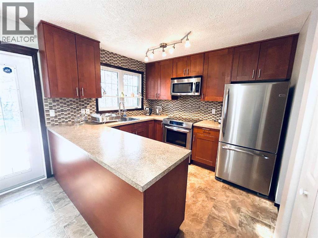 11 Lake Newell Crescent E, Brooks, Alberta  T1R 0L2 - Photo 5 - A2268628