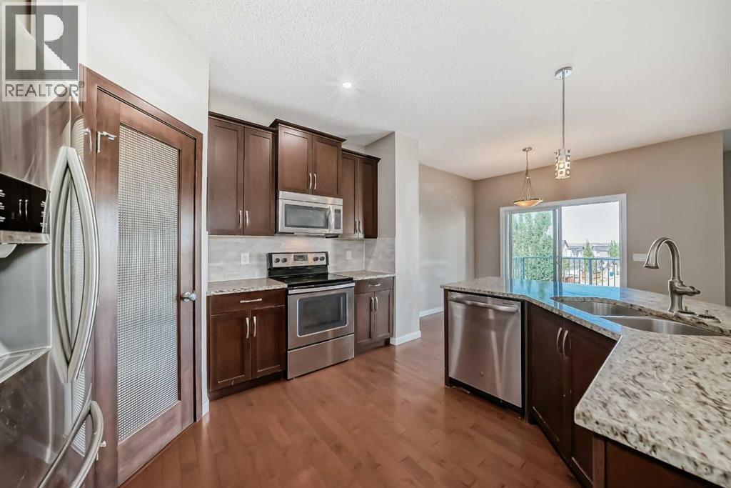 144 Reunion Grove Nw, Airdrie, Alberta  T4B 0Z2 - Photo 8 - A2262349