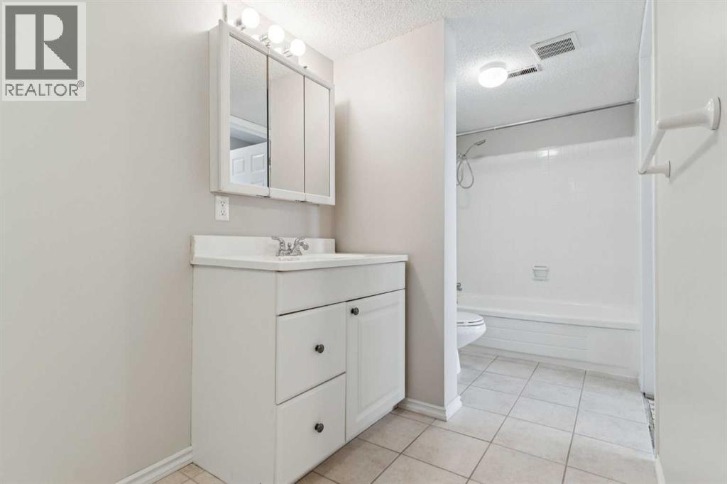 102, 7416 Hunterview Drive Nw, Calgary, Alberta  T2K 5J2 - Photo 20 - A2256834