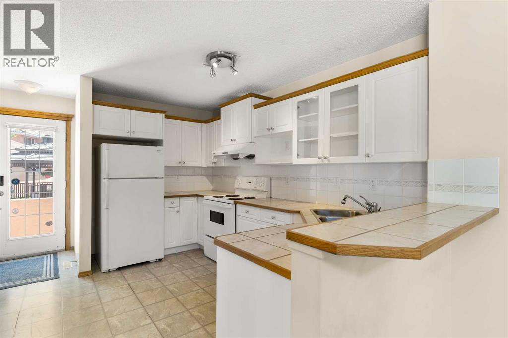 202 Coral Cove Ne, Calgary, Alberta  T3J 3Y9 - Photo 7 - A2269851