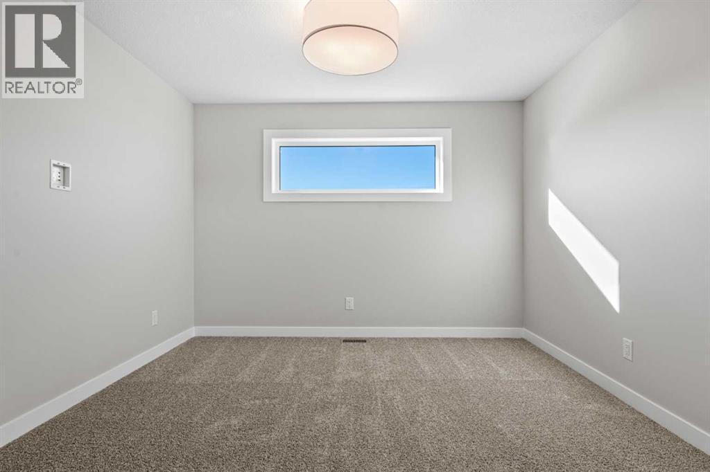 85 Quartz Crescent, Cochrane, Alberta  T4C 3G2 - Photo 16 - A2269392