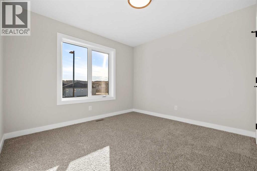 85 Quartz Crescent, Cochrane, Alberta  T4C 3G2 - Photo 25 - A2269392