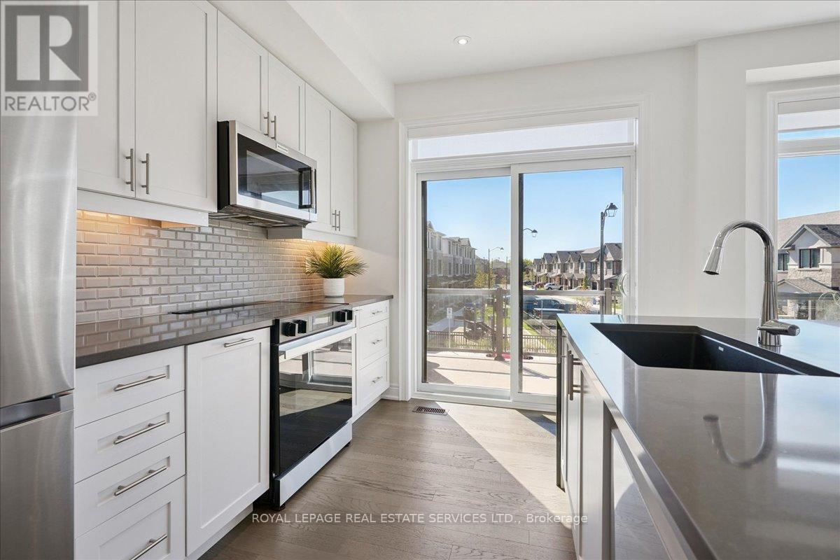 2180 Postmaster Drive, Oakville, Ontario  L6M 5T1 - Photo 9 - W12437859