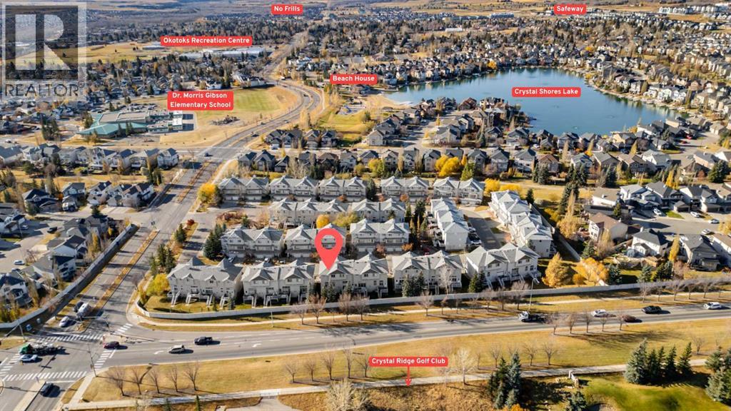 84 Crystal Shores Cove, Okotoks, Alberta  T1S 2B4 - Photo 3 - A2268390