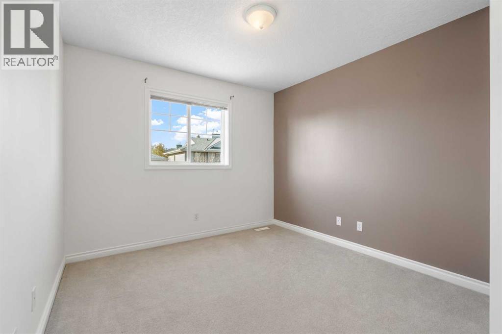 84 Crystal Shores Cove, Okotoks, Alberta  T1S 2B4 - Photo 32 - A2268390