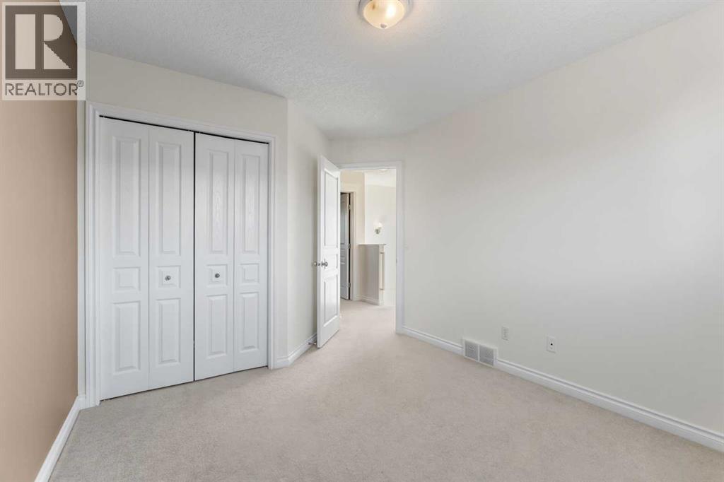 84 Crystal Shores Cove, Okotoks, Alberta  T1S 2B4 - Photo 34 - A2268390