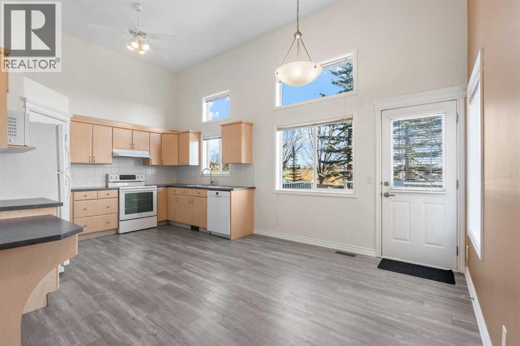 84 Crystal Shores Cove, Okotoks, Alberta  T1S 2B4 - Photo 9 - A2268390