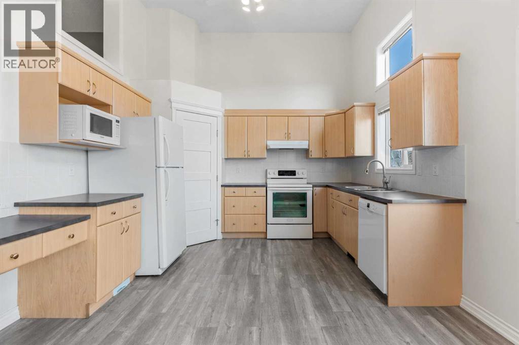 84 Crystal Shores Cove, Okotoks, Alberta  T1S 2B4 - Photo 15 - A2268390