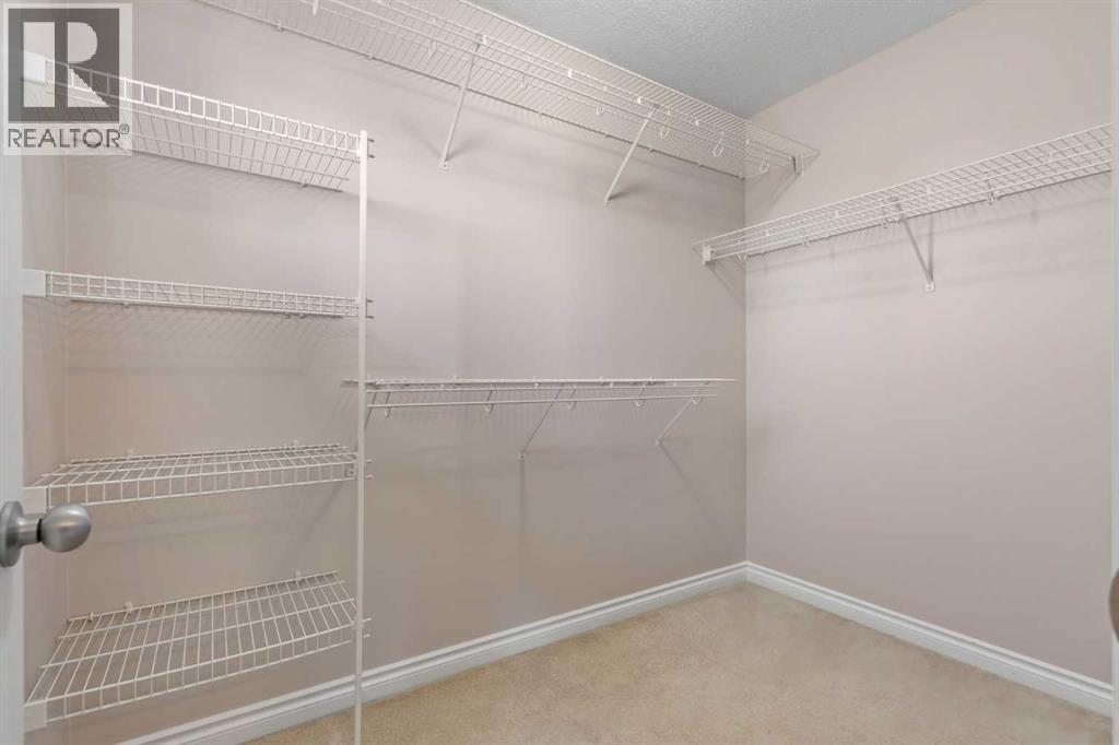 84 Crystal Shores Cove, Okotoks, Alberta  T1S 2B4 - Photo 38 - A2268390