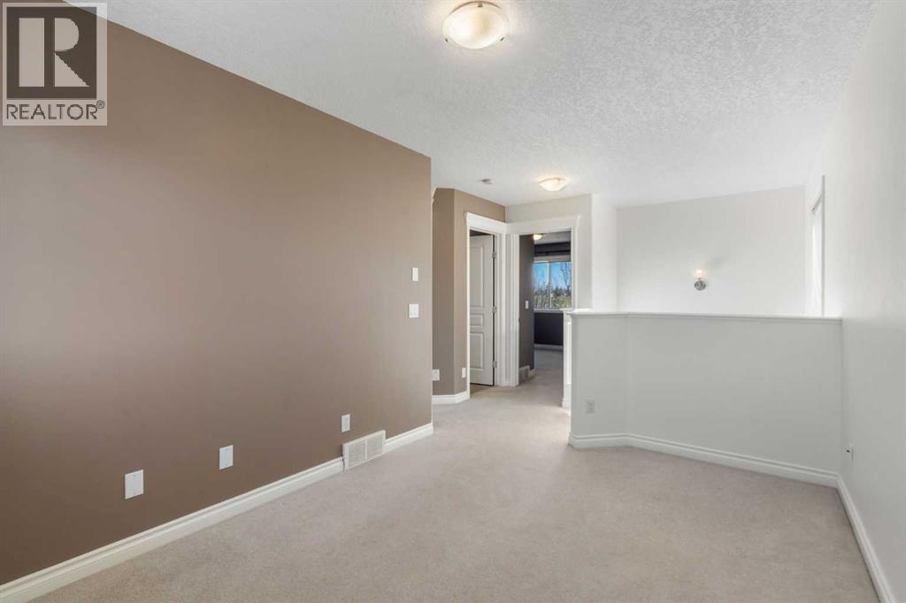 84 Crystal Shores Cove, Okotoks, Alberta  T1S 2B4 - Photo 31 - A2268390