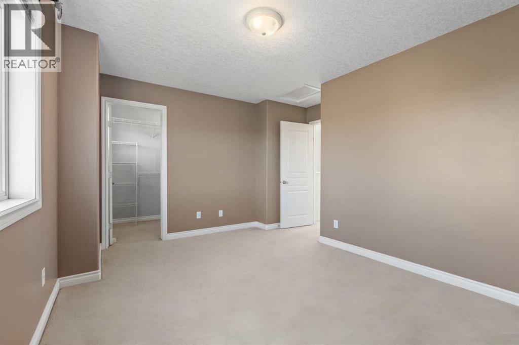 84 Crystal Shores Cove, Okotoks, Alberta  T1S 2B4 - Photo 37 - A2268390