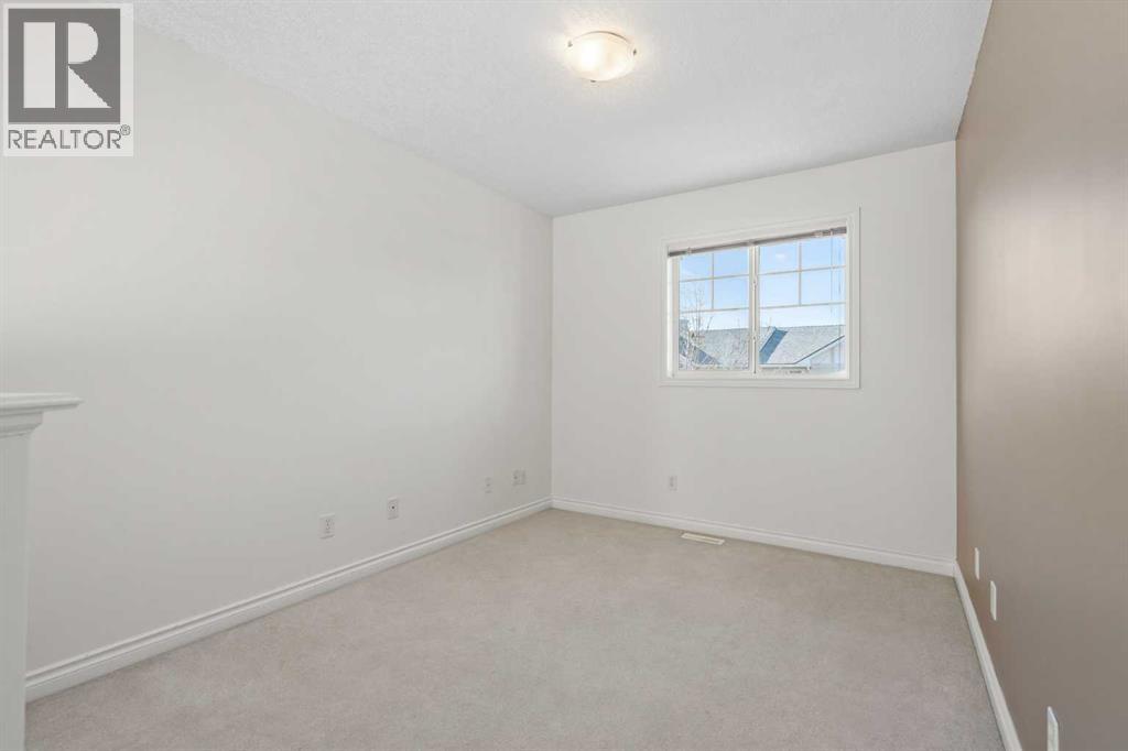 84 Crystal Shores Cove, Okotoks, Alberta  T1S 2B4 - Photo 29 - A2268390