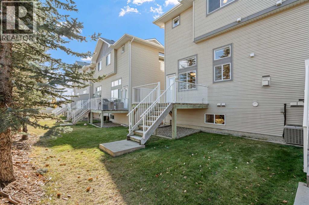 84 Crystal Shores Cove, Okotoks, Alberta  T1S 2B4 - Photo 46 - A2268390