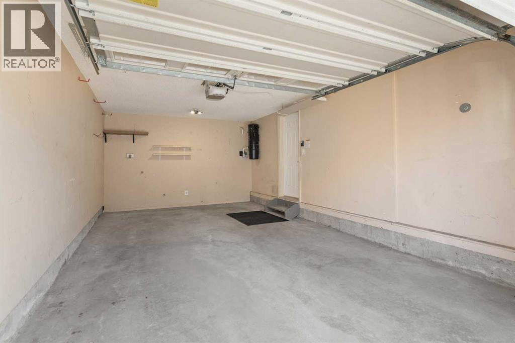 84 Crystal Shores Cove, Okotoks, Alberta  T1S 2B4 - Photo 41 - A2268390