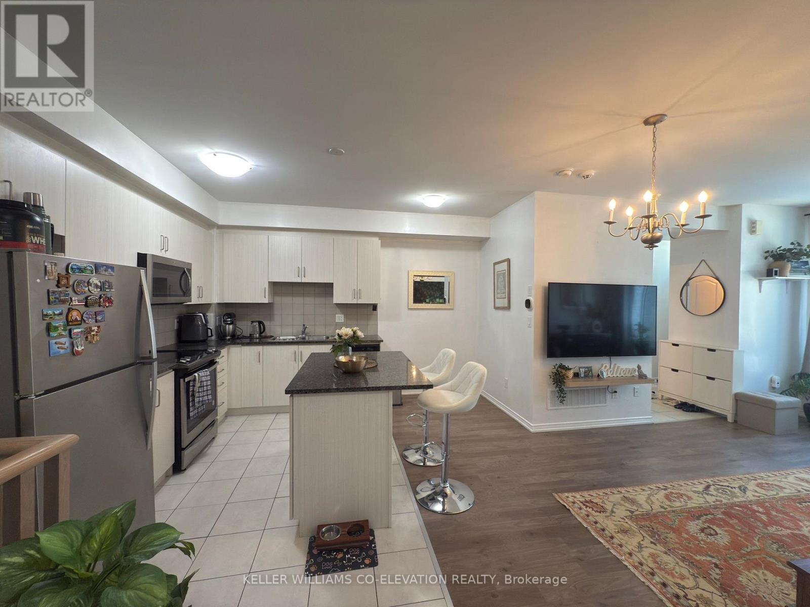 112 - 11 Applewood Lane, Toronto, Ontario  M9C 2Z7 - Photo 2 - W12532430