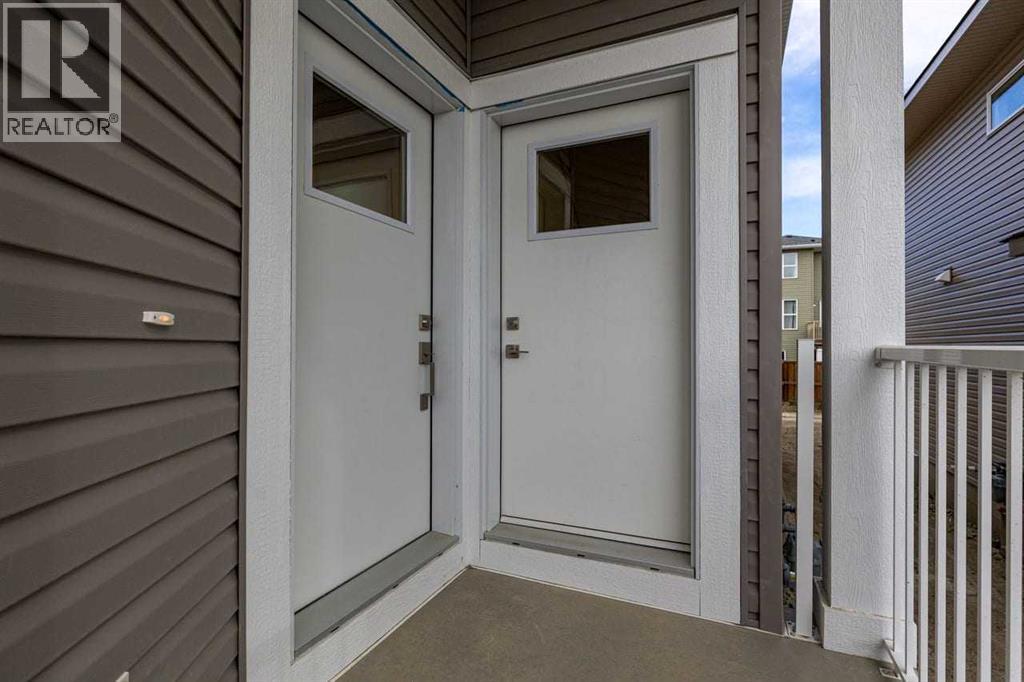 90 Heritage Circle, Cochrane, Alberta  T4C 3G9 - Photo 37 - A2267772