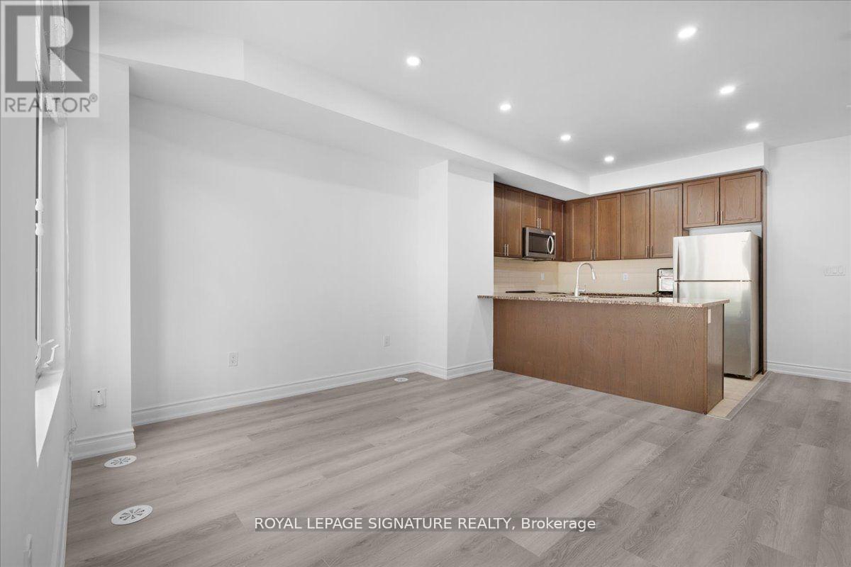 61 - 35 Applewood Lane, Toronto, Ontario M9C 0C1 - Photo 4 - W12535130