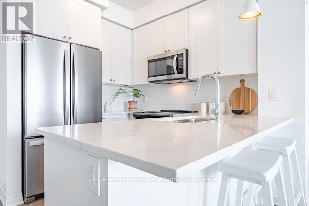 422 - 610 Farmstead Drive, Milton, Ontario  L9T 8X5 - Photo 7 - W12541266