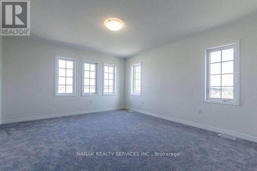 583 Queen Mary Drive, Brampton, Ontario L7A 5H3 - Photo 4 - W12542030