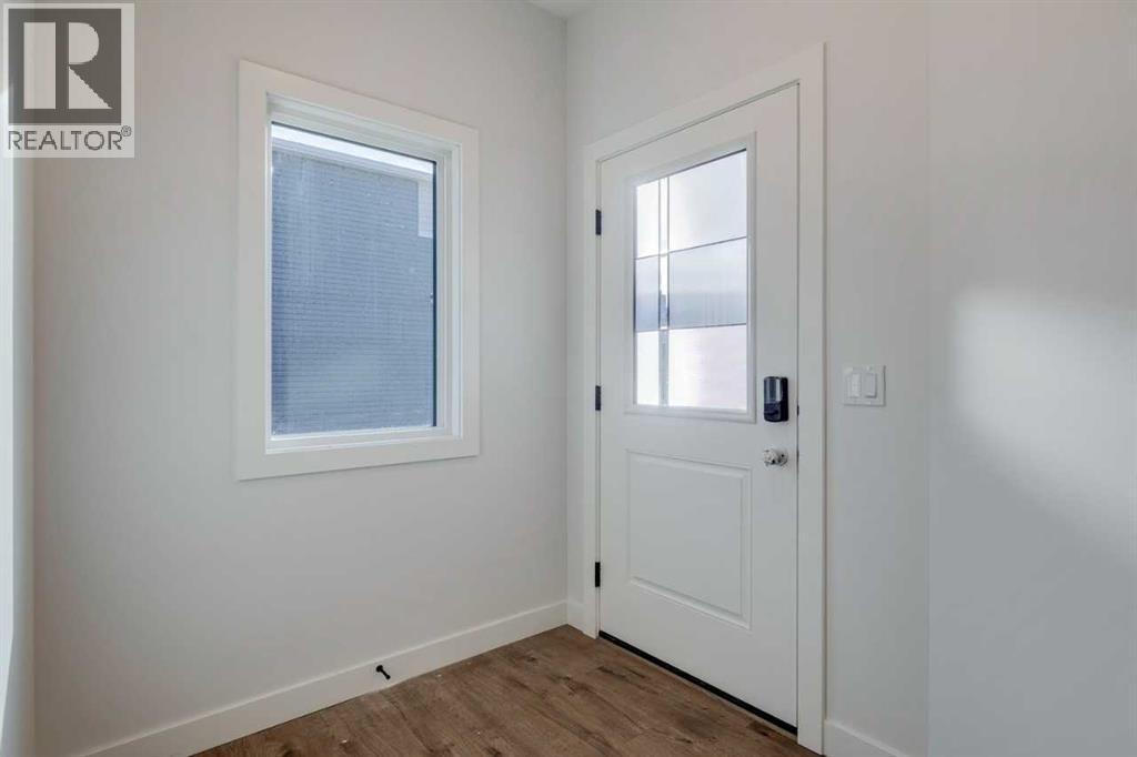 54 Amblefield Common Nw, Calgary, Alberta  T3P 2L5 - Photo 3 - A2249603