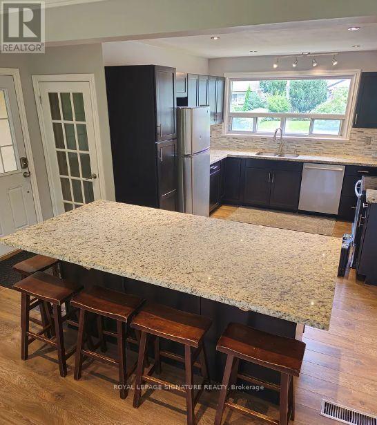 1457 Rometown Drive, Mississauga, Ontario  L5E 2T6 - Photo 3 - W12544680