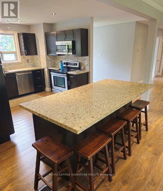 1457 Rometown Drive, Mississauga, Ontario  L5E 2T6 - Photo 4 - W12544680