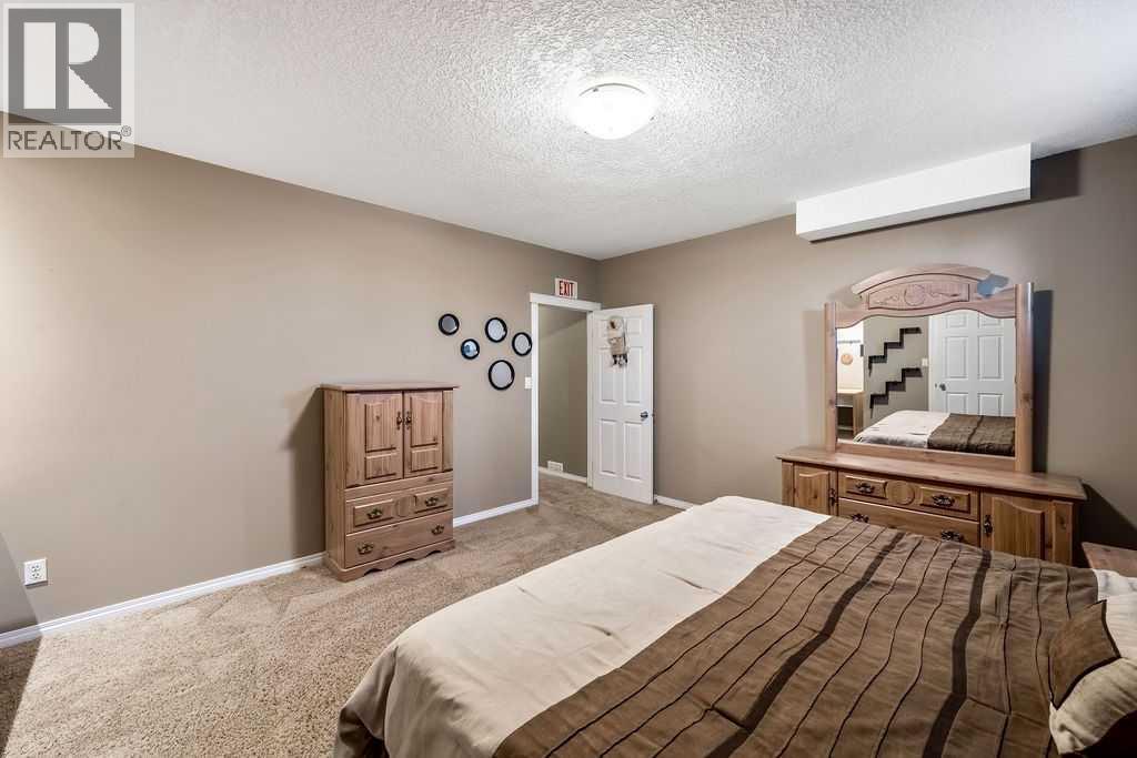 51 Norris Coulee Trail, De Winton, Alberta  T1S 5A5 - Photo 35 - A2267806