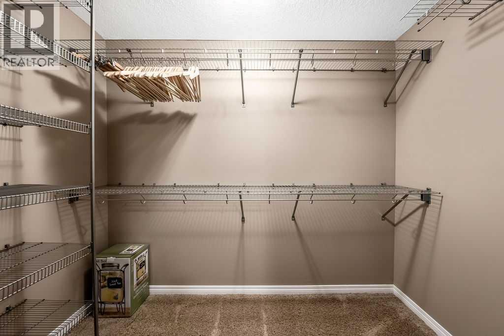 51 Norris Coulee Trail, De Winton, Alberta  T1S 5A5 - Photo 36 - A2267806