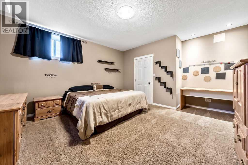 51 Norris Coulee Trail, De Winton, Alberta  T1S 5A5 - Photo 34 - A2267806