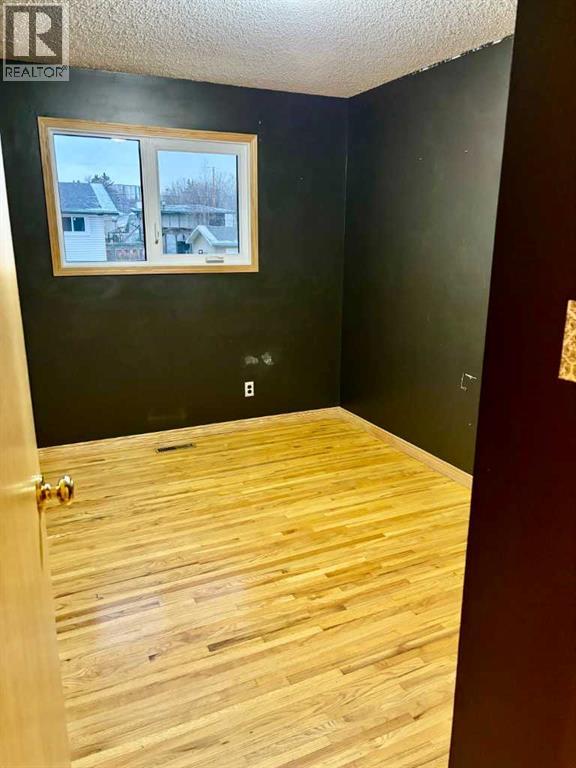 7711 Bowcliffe Crescent Nw, Calgary, Alberta  T3B 2S5 - Photo 10 - A2260325