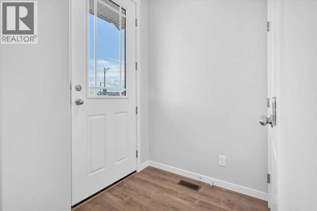 74 Wedderburn Drive, Okotoks, Alberta  T1S 5X2 - Photo 9 - A2235036