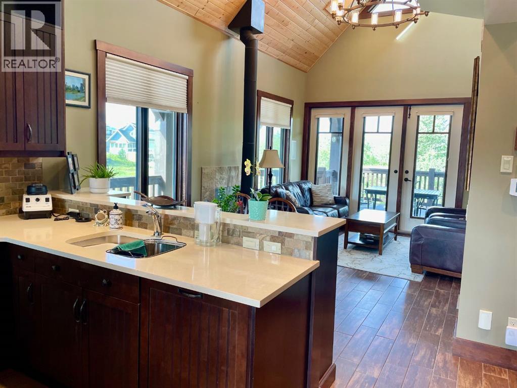 249 Cottageclub Crescent, Rural Rocky View County, Alberta  T4C 1B1 - Photo 5 - A2247550