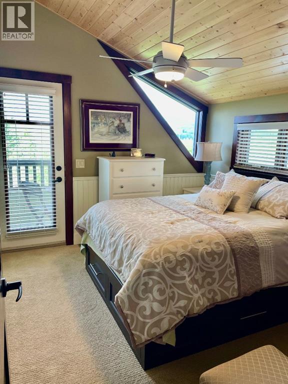 249 Cottageclub Crescent, Rural Rocky View County, Alberta  T4C 1B1 - Photo 19 - A2247550