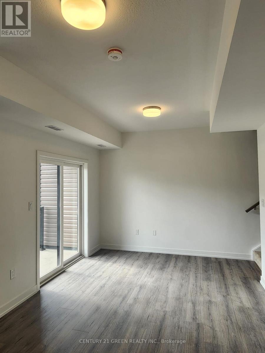 104 - 940 St David Street N, Centre Wellington, Ontario  N1M 0L4 - Photo 2 - X12549446