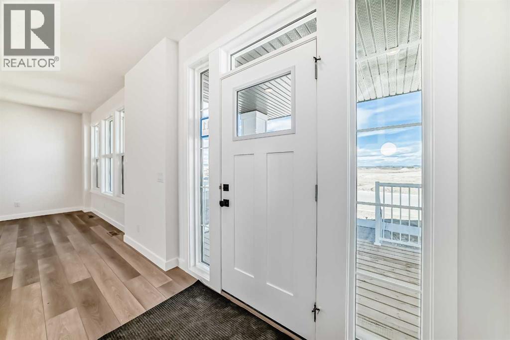 211 Perch Bend, Rural Rocky View County, Alberta  T3Z 0J9 - Photo 3 - A2250129