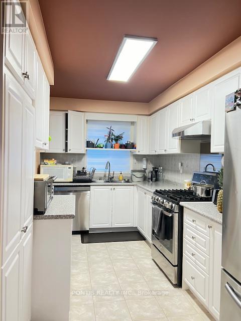 108 - 7115 Rexwood Road, Mississauga, Ontario  L4T 4L5 - Photo 3 - W12551314