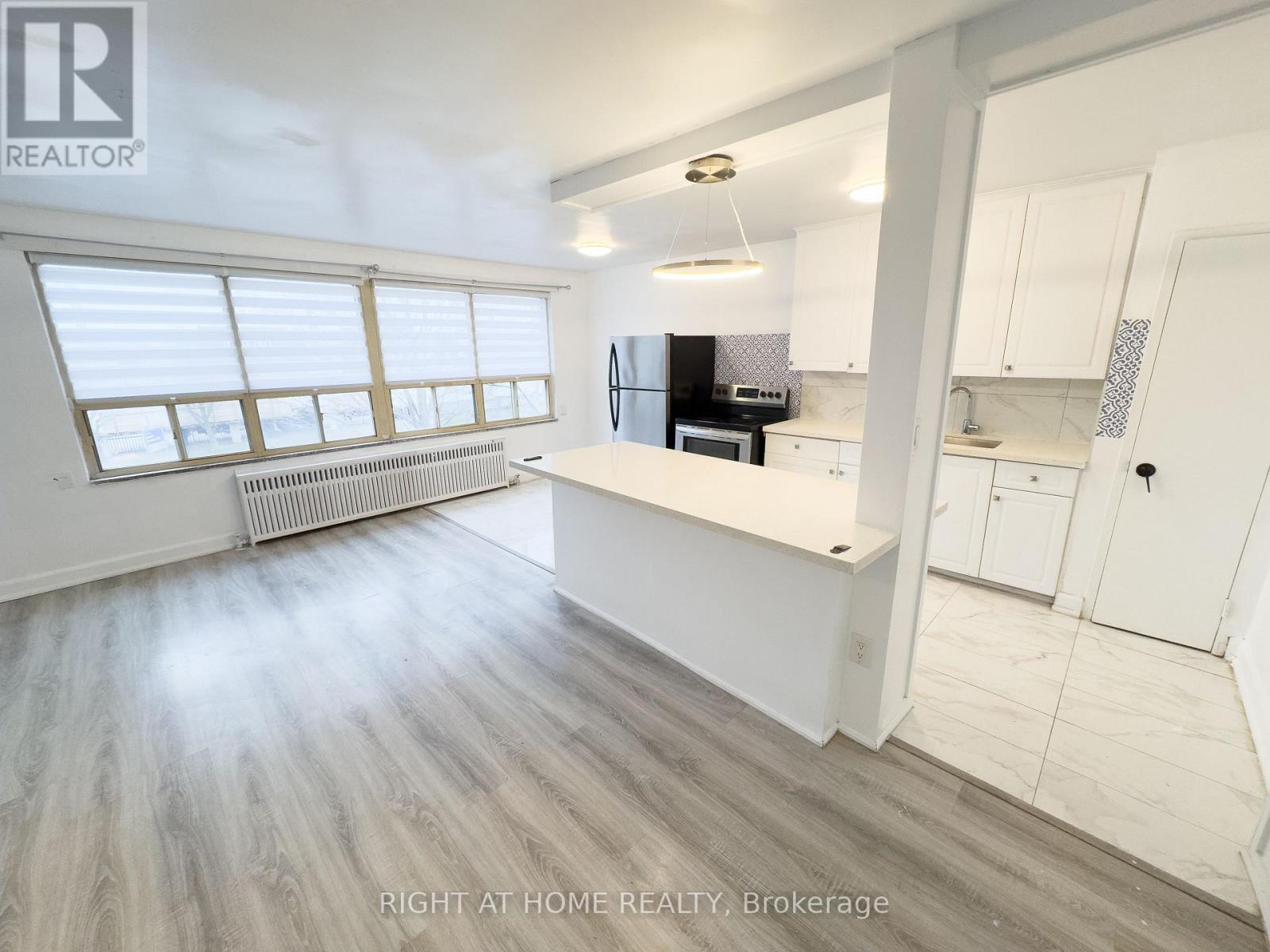 214 - 896 Eglinton Avenue E, Toronto, Ontario  M4G 2L2 - Photo 1 - C12551650