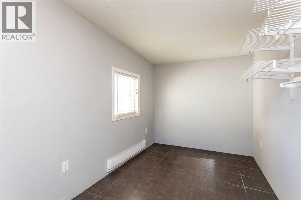 7 Parkland Acres, Lacombe, Alberta  T4L 1T2 - Photo 7 - A2269385