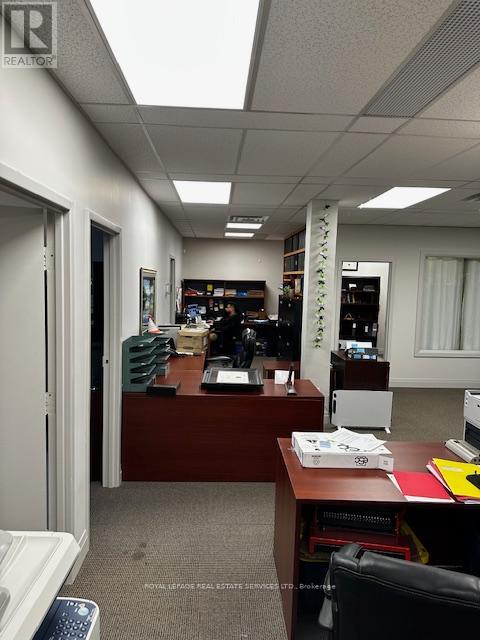 200 - 235 Lakeshore Road E, Oakville, Ontario  L6J 1A7 - Photo 4 - W12552664