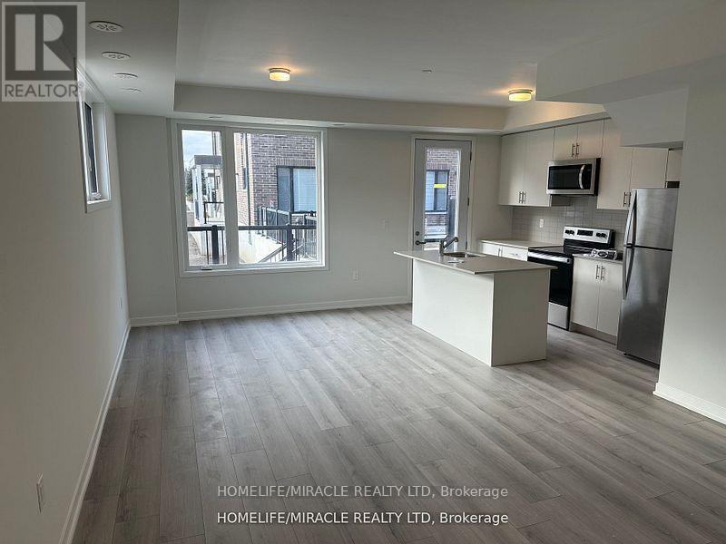 02 - 3415 Ridgeway Drive, Mississauga, Ontario  L5L 0B9 - Photo 3 - W12555412