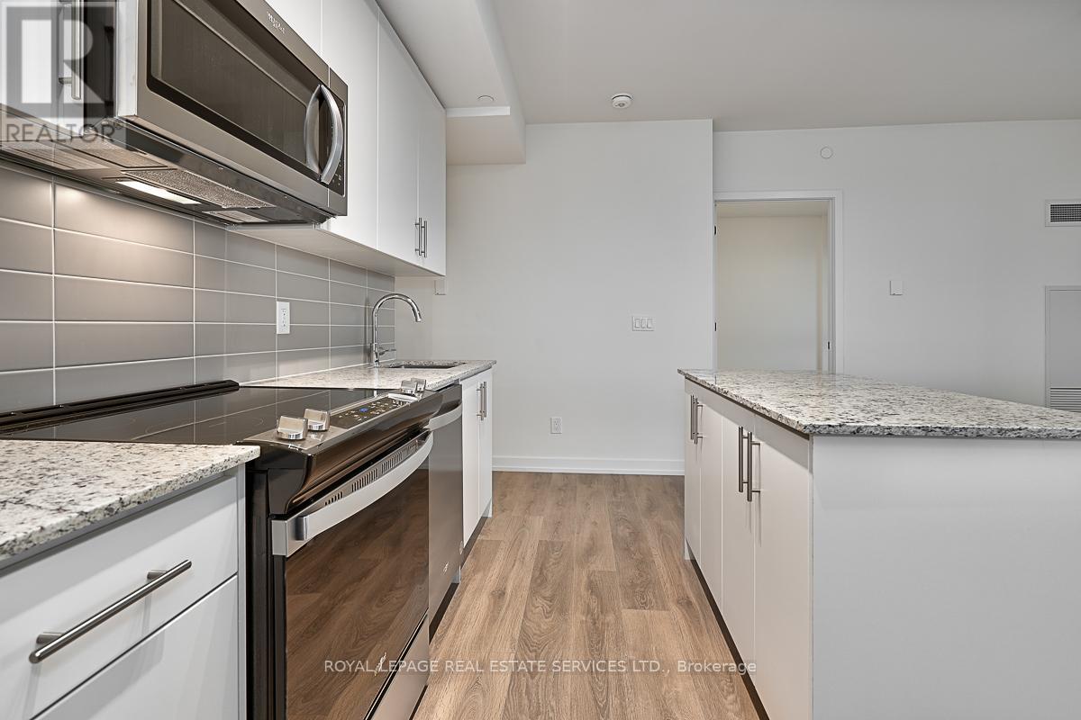 610 - 345 Wheat Boom Drive, Oakville, Ontario  L6H 7X4 - Photo 5 - W12555806