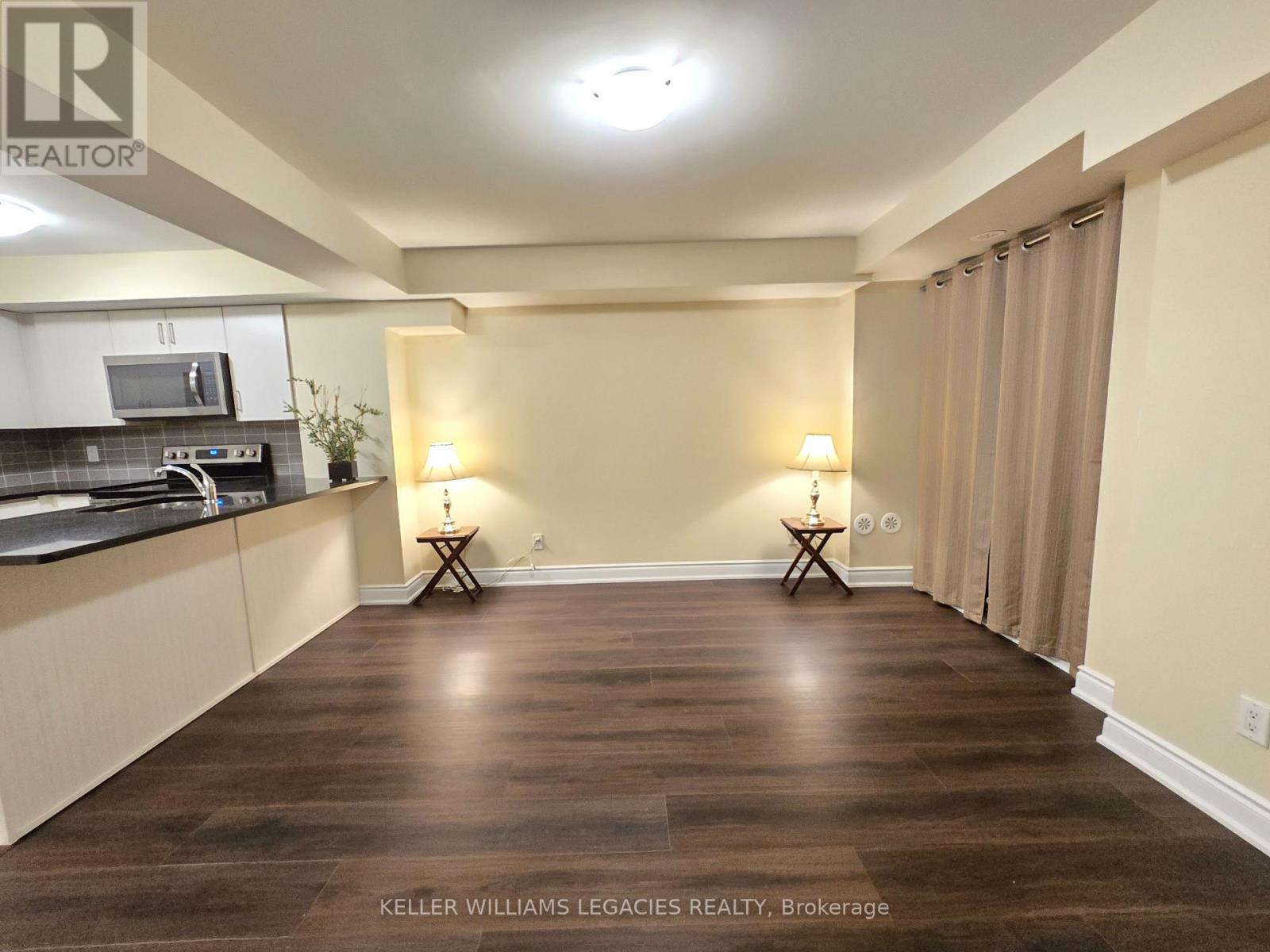 107 - 7 Applewood Lane, Toronto, Ontario  M9C 2Z7 - Photo 4 - W12557364