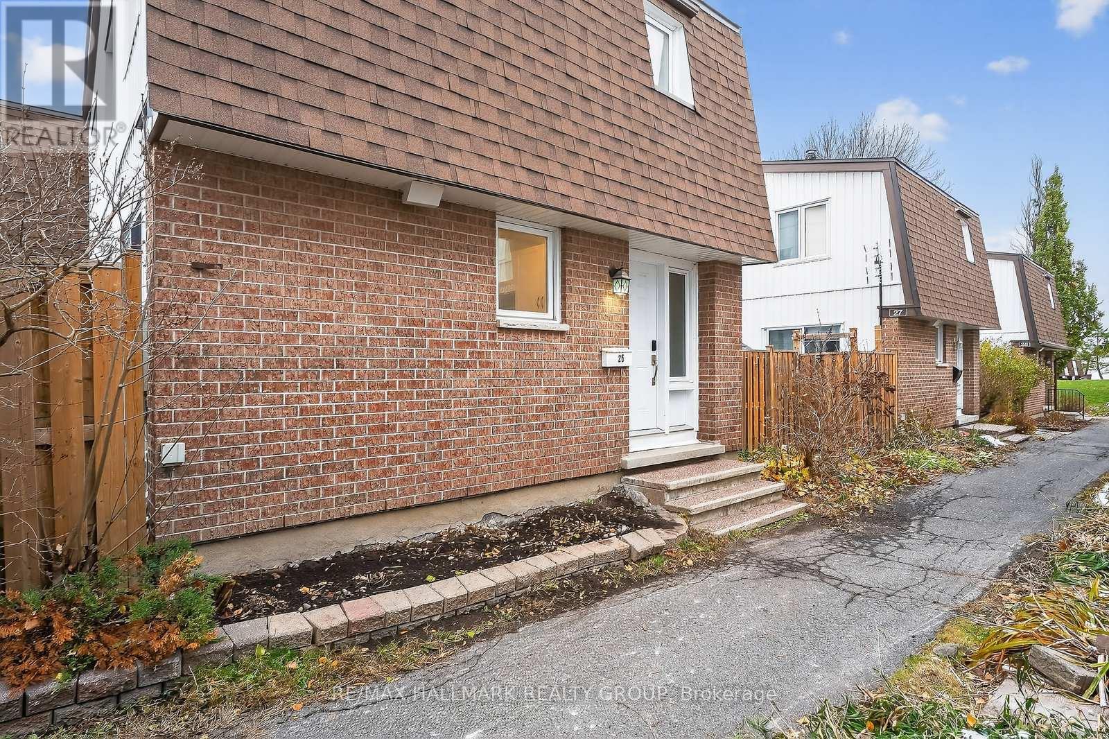 837 EASTVALE DRIVE - UNIT 26 sits this 3 bedroom 2 full bathroom townhouse with plenty of space .The complex is designed with no adjoining walls ( like a detached dwelling ) and this unit has an unobstructed view west ,a very bright and sunny unit and yard  , a few steps away from open green fields , toboggan hills , close to visitors parking ,choice parking spot at your unit ,fully fenced in (and private) patio'd yard c/w a garden shed , unit has many updates such as fully renovated kitchen, cabinetry, flooring ,stainless steel appliances , pot lighting & task lighting , backsplash , formal dining room which opens to a spacious living room , both living room and kitchen have double glass sliding patio doors which lead out to the west facing yard . Upstairs are 3 generous sized bedrooms , all with large operational windows, plenty of closet space ,very bright . As well a recently reno'd  5 piece bathroom ( 2 sinks ),newer vanity and tiled flooring , new(er) flooring on both main and most of second floor . Down to the lower level is the second full bathroom which houses the laundry facilities (new washer/dryer) plus a stand up shower, again plenty of room/very spacious . A smaller room which would make for great computer nook also gives access to the furnace and hot water tank , add to that a rec room ,great for a ping pong table , or flat screen ..... many possibilities -new drywall ceiling in rec room . Good strong condo corp , close to all amenities ,rec facilities (Sens Plex) ,Ottawa River pathway system, the new LRT is a very short walk away ,Costco, quality schools including the re-known Colonel By ( the IB program ) plus ,plus plus . (id:48254)