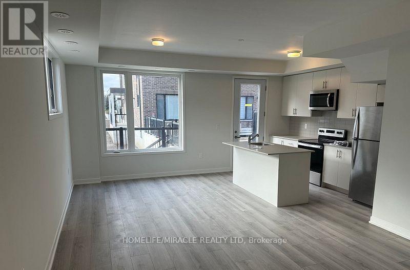 02 - 3415 Ridgeway Drive, Mississauga, Ontario  L5L 0B9 - Photo 3 - W12562684