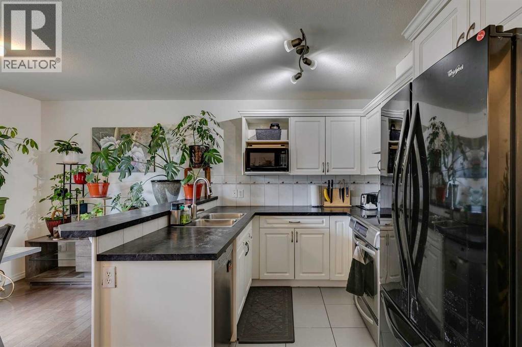 51 Spring Meadows Bay, Okotoks, Alberta  T1S 2G8 - Photo 7 - A2259710