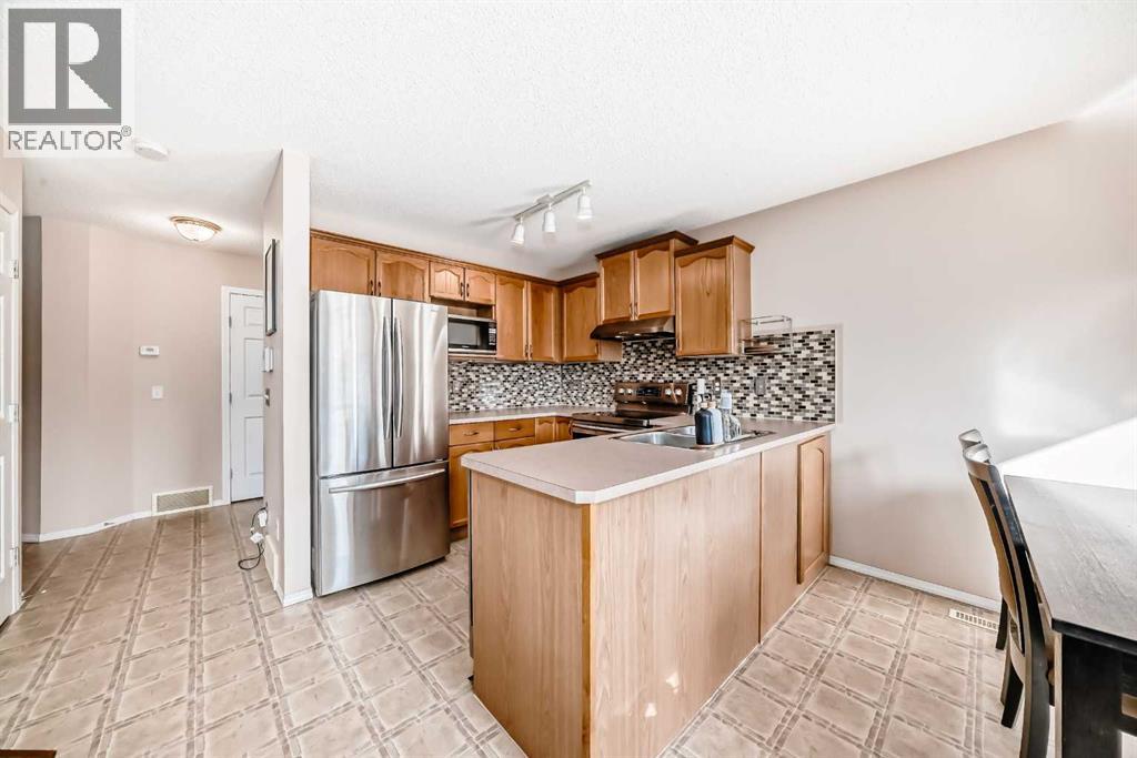 238 Bridleridge Way Sw, Calgary, Alberta  T2Y 4M6 - Photo 6 - A2266444