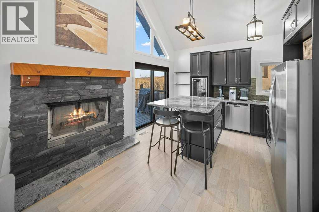 247 Cottageclub Crescent, Rural Rocky View County, Alberta  T4C 1B1 - Photo 9 - A2271474