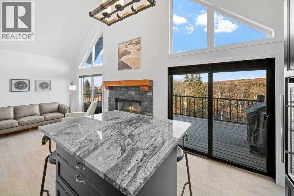 247 Cottageclub Crescent, Rural Rocky View County, Alberta  T4C 1B1 - Photo 14 - A2271474