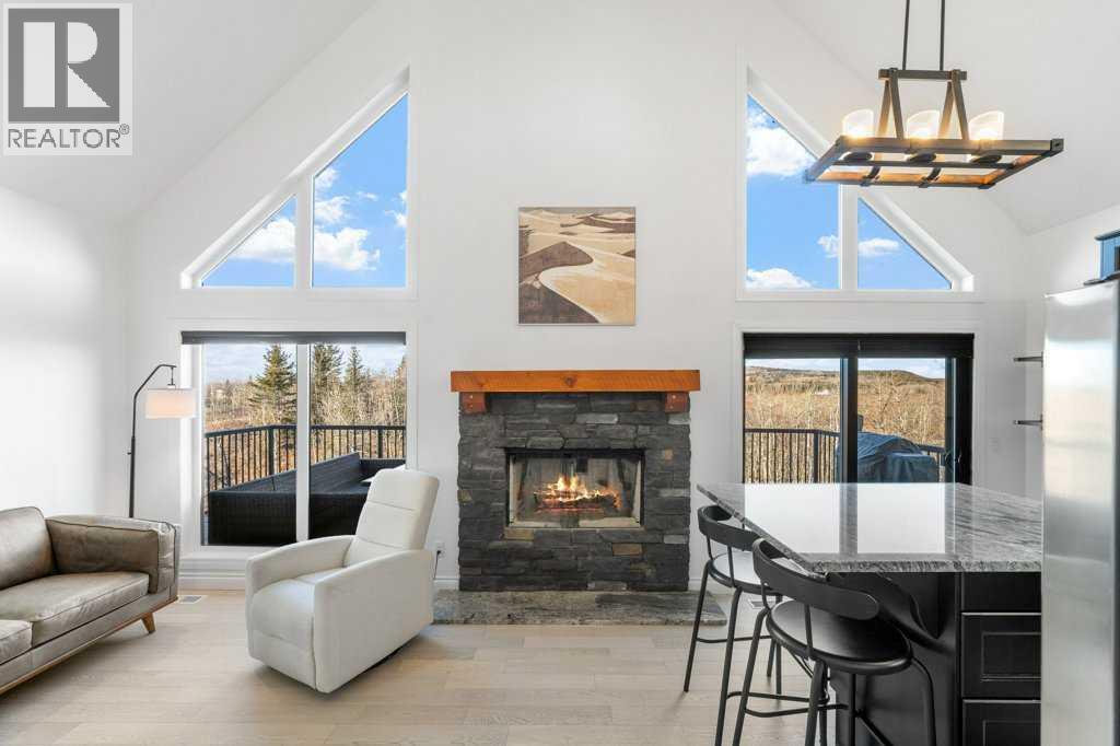 247 Cottageclub Crescent, Rural Rocky View County, Alberta  T4C 1B1 - Photo 5 - A2271474