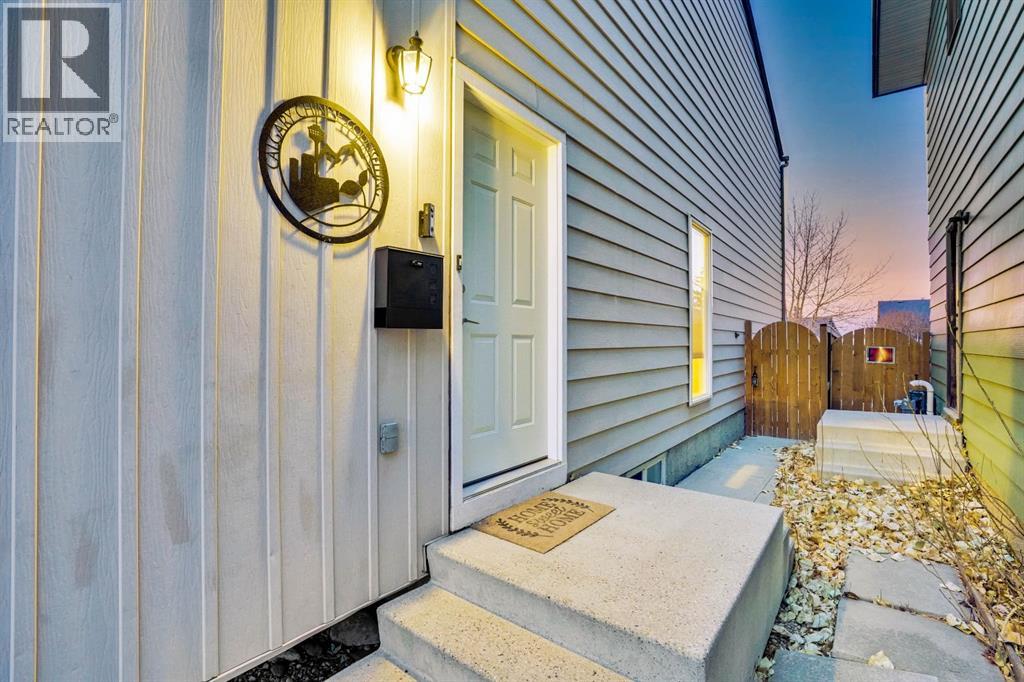 1038 Berkley Drive Nw, Calgary, Alberta  T3K 1A3 - Photo 2 - A2269891